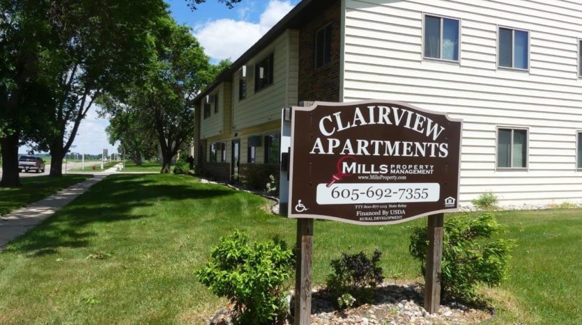 Clairview Apartments in Brookings, SD - Property Sign with Building Exterior