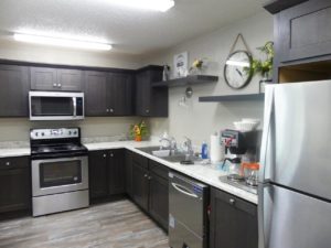Arrowhead Apartments in Brookings, SD - Community Room Kitchen