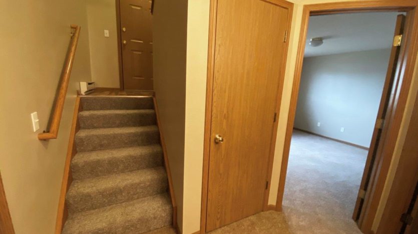 Springwood Townhomes in Watertown, SD - Lower Level Stairs and Storage