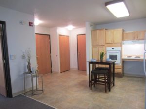 Pheasant Run Apartments in Brookings, SD - Kitchen and Front Entrance
