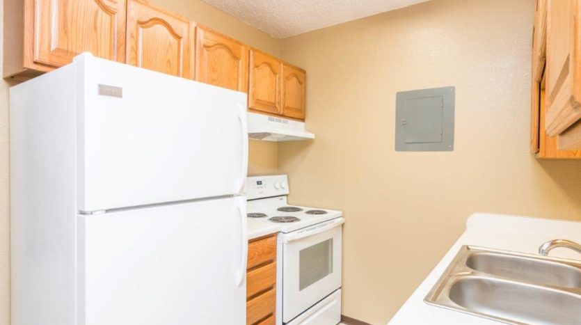 Village Square Apartments in Brookings, SD - Alternate Kitchen Layout Fridge View