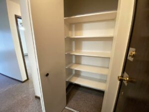 Palace Apartments & Townhomes in Mitchell, SD - 1 Bedroom Apartment Front Closet