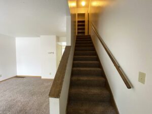 Palace Apartments & Townhomes in Mitchell, SD - 2 Bedroom Townhome Staircase