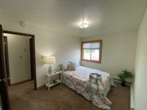 Village Pointe Apartments in Mitchell, SD - Staged Unit Bedrom 1