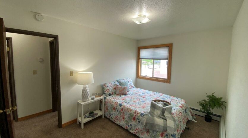Village Pointe Apartments in Mitchell, SD - Staged Unit Bedrom 1