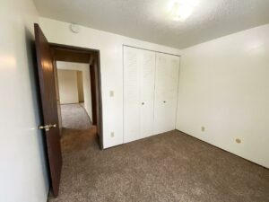 Village Pointe Apartments in Mitchell, SD - Bedroom 2 Closet