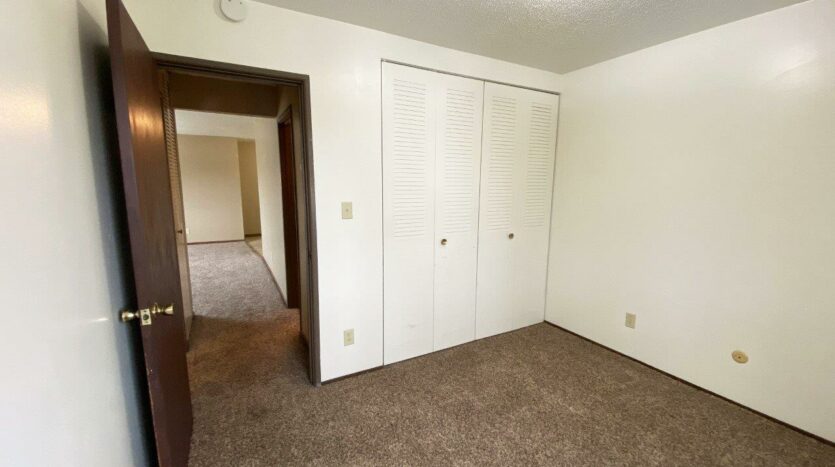 Village Pointe Apartments in Mitchell, SD - Bedroom 2 Closet