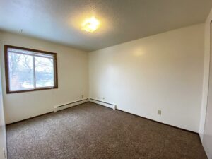 Village Pointe Apartments in Mitchell, SD - Bedroom 1