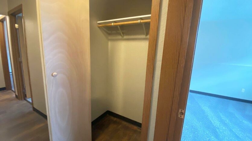 Prairie Circle Apartments in Brookings, SD - Lower Level Apartment Hallway Closet
