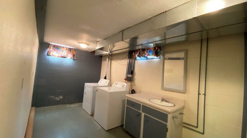813 NE 8t Street in Madison, SD - Downstairs Laundry and Bathroom
