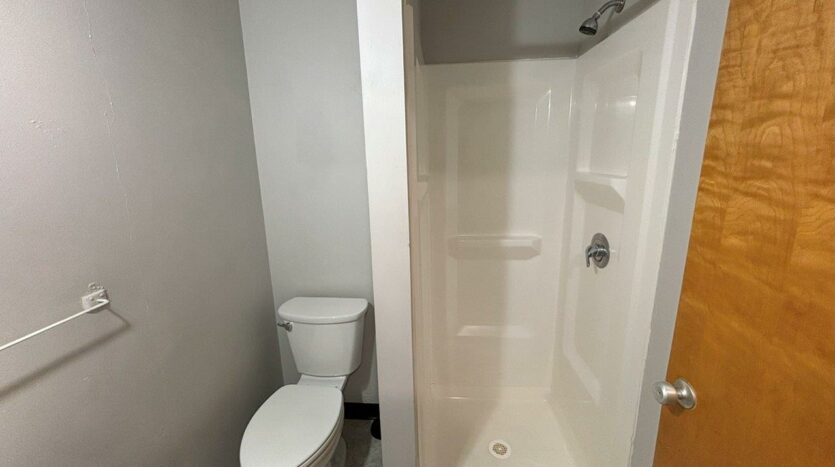 3rd & Main in Brookings, SD - Bathroom Shower + Toilet