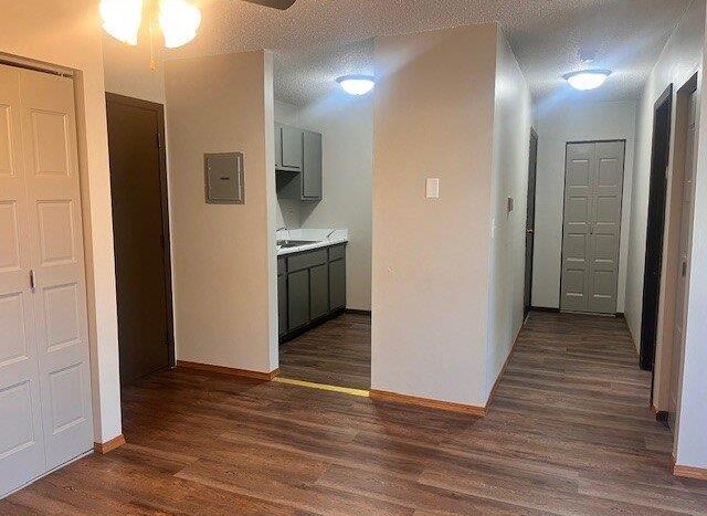 Walsen Apartments in Lennox, SD - Hallway + Kitchen View