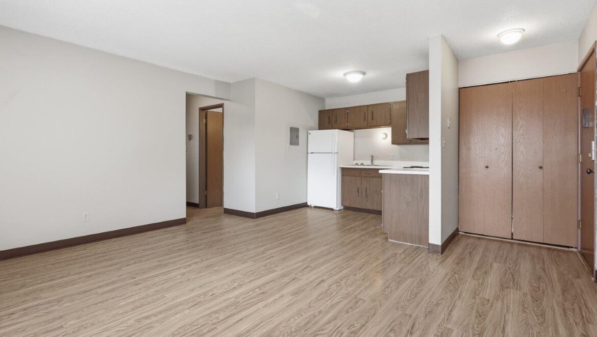 Brooks Manor Apartments in Brookings, SD - Kitchen + Living Room View