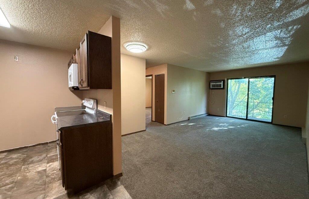Cedar Apartments in Brookings, SD - Living Room + Kitchen
